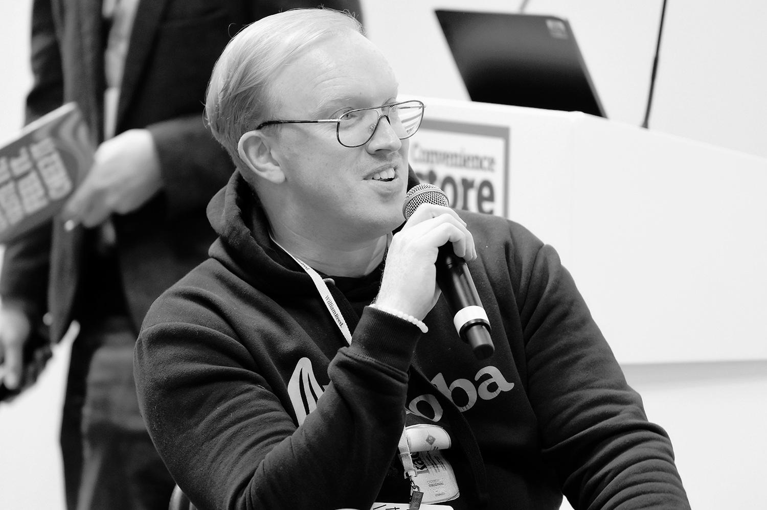 Mathew Halford speaking at a conference